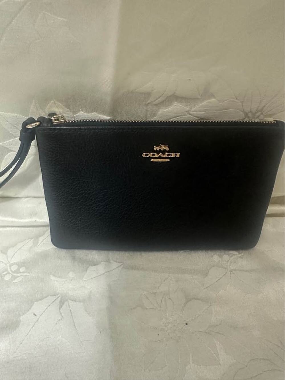 Pre-loved Coach Black Pebbled Leather Wristlet. B-303